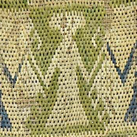 Détail de la broderie précédente cadrée sur un personnage.
La tête a une forme de triangle pointe en bas.
Les points de brique non coupés en haut, lui donnent une sorte de coiffure avec des piques vers le haut.